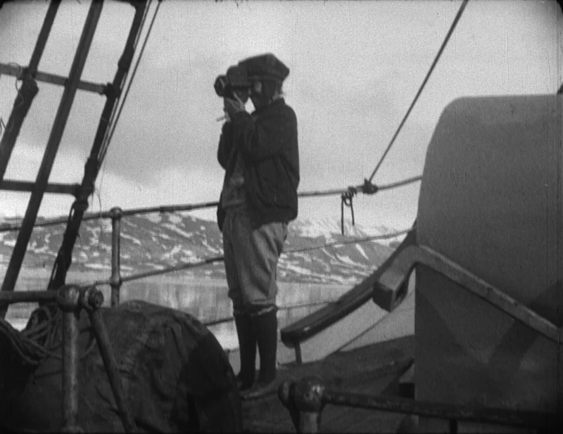 Louise Boyd operating a 16mm movie camera during the 1928 search for Roald Amundsen.